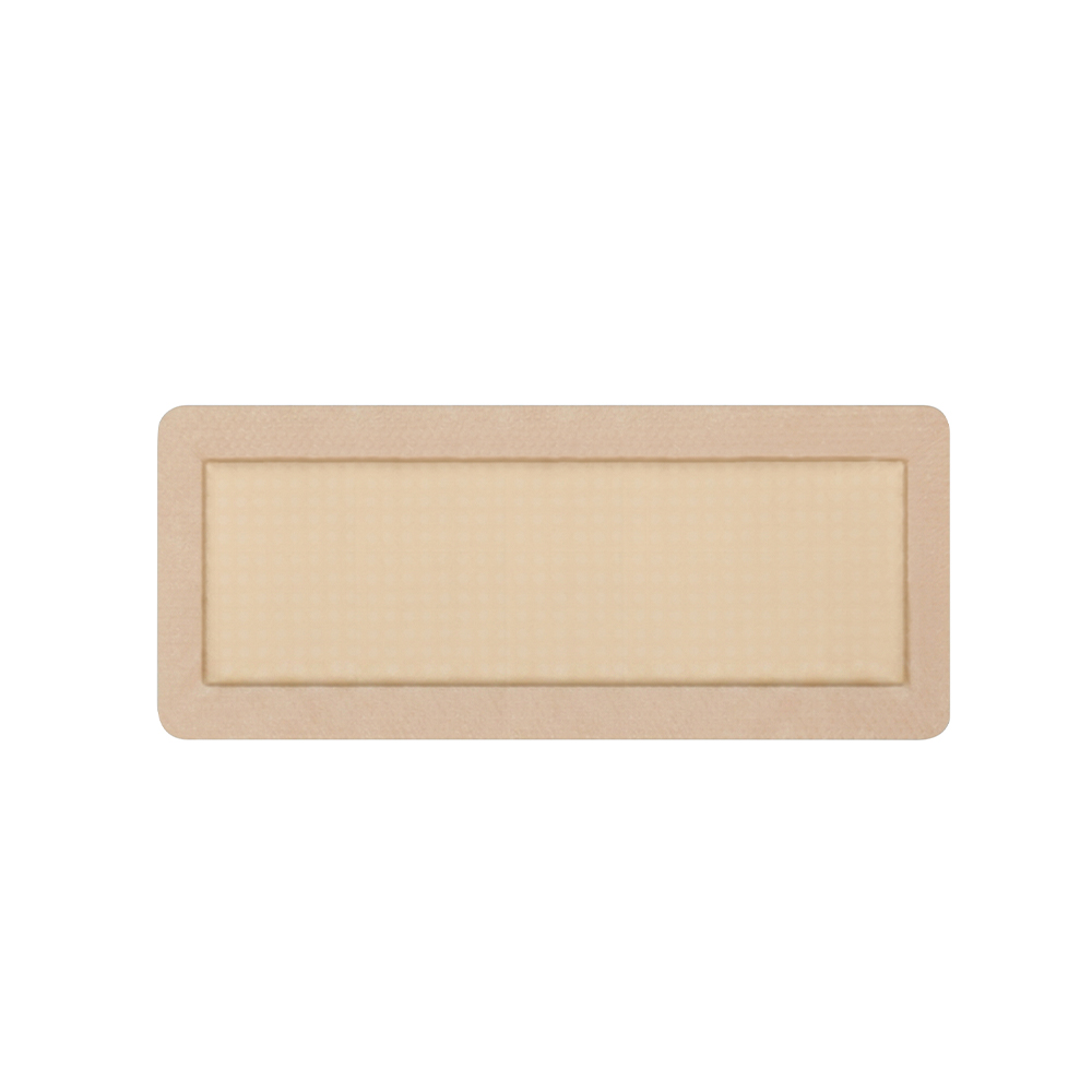 Pansement rectangulaire en mousse bordée de silicone de 30 x 10 cm de long